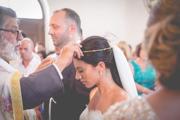 The crowning at a Greek Orthodox wedding in Peyia, Paphos, photographed by Evagoras Mandrides
