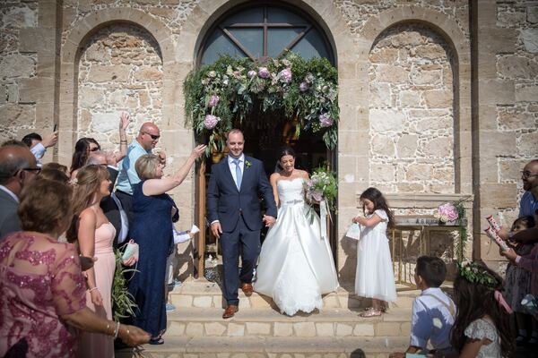 Bride and groom leaving Agios Georgios Church, Peyia, photographed by Evagoras Mandrides
