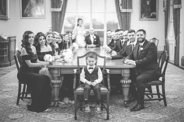 The wedding party in one of the rooms at Hylands House, Chelmsford, photographed by Evagoras Mandrides