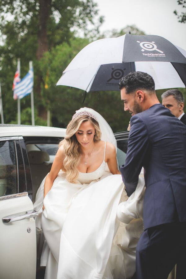 The bride arriving at church for a Greek Orthodox wedding in North London, photographed by Evagoras Mandrides