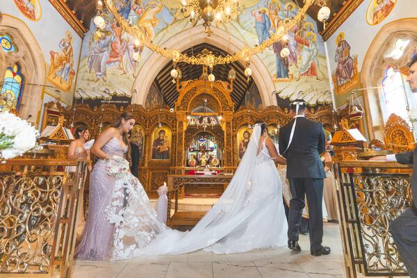 Bride and groom during a Greek Orthodox wedding ceremony in North London, photographed by Evagoras Mandrides