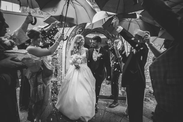 Confetti as the couple leave the church at a Hertfordshire wedding, photographed by Evagoras Mandrides