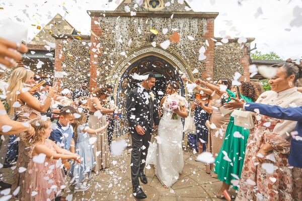 Confetti as the couple leave the church at a Greek Orthodox wedding in North London, photographed by Evagoras Mandrides