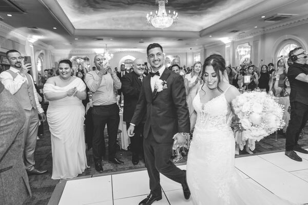 The couple's entrance at a North London wedding reception, photographed by Evagoras Mandrides