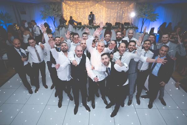 The groom and his friends on the dance floor at Hylands House, photographed by Evagoras Mandrides