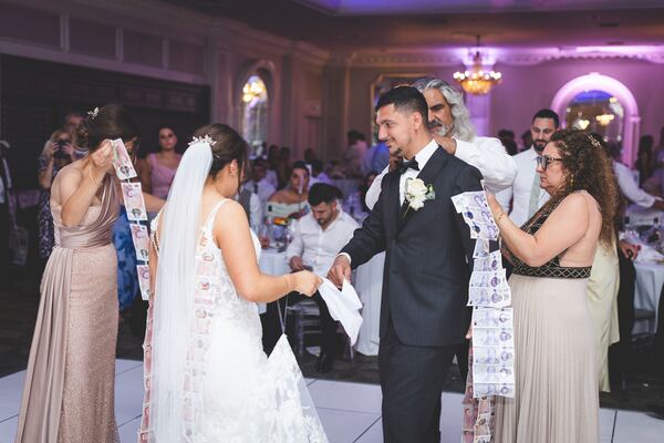 The money dance at a Greek Cypriot wedding reception in North London, photographed by Evagoras Mandrides
