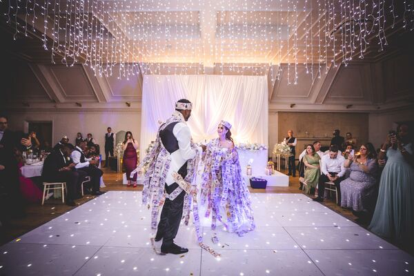 The money dance at a Greek Cypriot wedding in Essex, photographed by Evagoras Mandrides