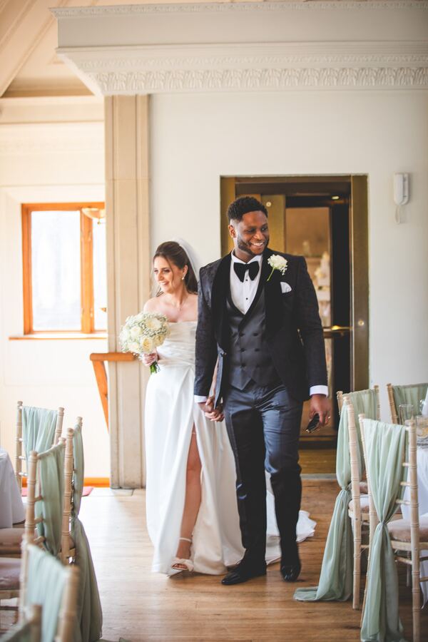 Bride and groom seeing the reception room at Stock Brook Country Club, photographed by Evagoras Mandrides