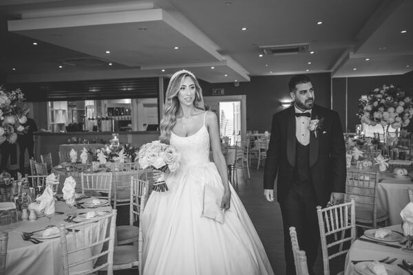 Bride and groom in the reception room at the Manor of Groves, Sawbridgeworth, photographed by Evagoras Mandrides